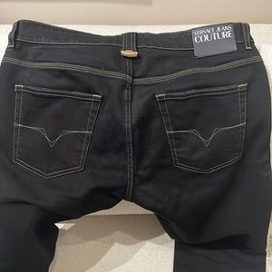 Almost new pair of Black Versace jeans